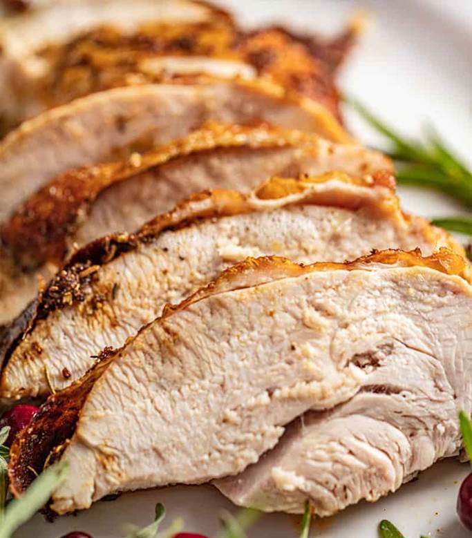 a sliced oven roasted turkey breast.